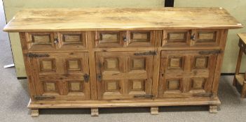 A large continential antique style wooden sideboard.