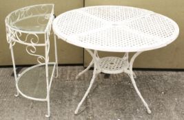 A cast metal garden table and a side table with shelves.