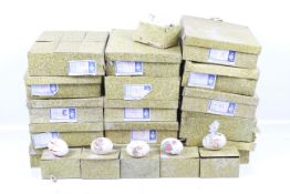 A collection of boxed Chinese decorative eggs.