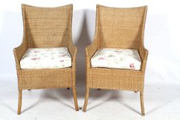 A pair of wicker chairs.