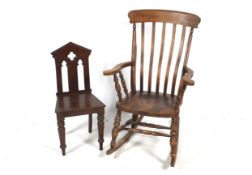 A Windsor style rocking chair and a mahogany 'Gothic' style hall chair. Max.