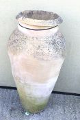 A large terracotta baluster shaped garden vase/pot.