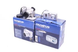 Two Olympus Camedia digital compact cameras. To include a C-170 and a C-770 Ultra Zoom.