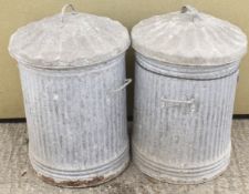 Two vintage galvanised metal bins. Having lids and twin handles.
