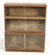 A 20th century limed oak glazed cupboard.