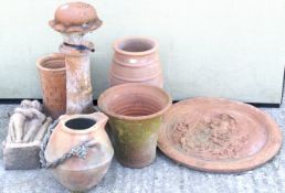 An assortment of terracotta pots and garden ornaments.