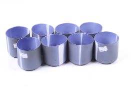 A set of eight handmade studio art glass beakers. Having matte exterior, 'PS, 2000' to the base.