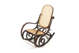 A circa 1970s Thonet style bentwood and caned rocking chair.
