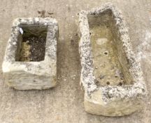 Two stone garden planters.