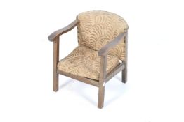 An early 20th century child's oak framed open arm chair. Stamp to base 'CC 132 / F531'.