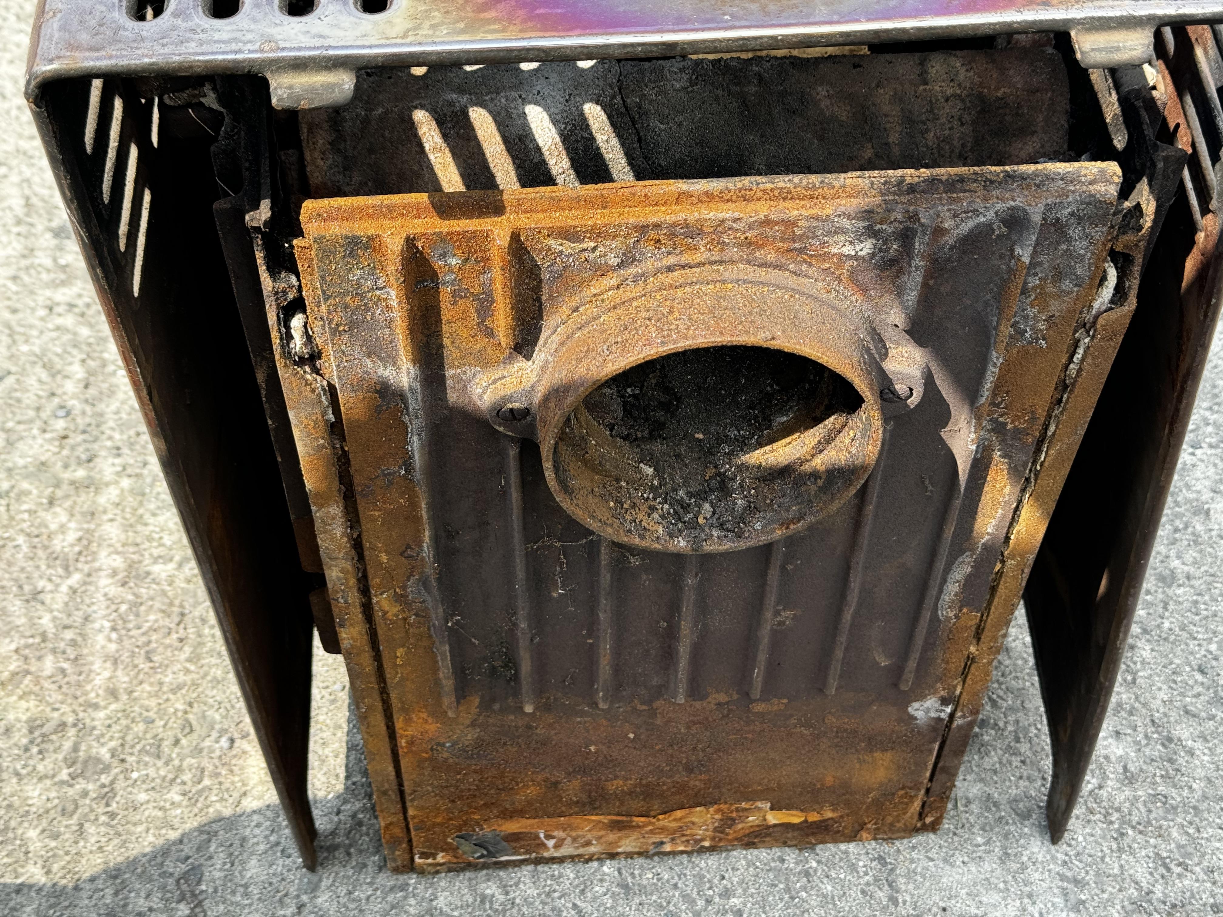 A metal woodburning stove. With hinged front doors and spare metal plates, H60cm x W44cm x D30cm. - Image 2 of 4