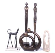 Five contemporary ornamental sculptures. Including a pair of wooden figures on square plinths, etc.