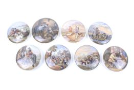 A collection of eight assorted vintage Prattware pot lids.