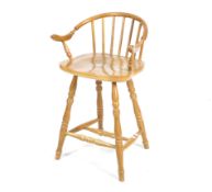 A late 20th century wooden bar stool.