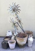 An assortment of garden pots and ornaments.