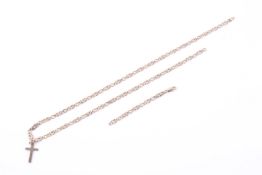 A 9ct gold fancy figure-of-eight link chain and a Latin cross.