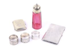 A silver engine turned rectangular cigarette case and other items.