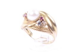 A vintage Continental cultured-pearl and gem set dress ring. The head centred with a 6.