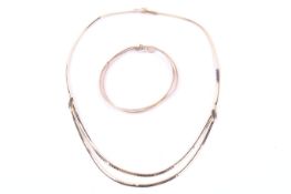 A modern fancy cable-link two-row necklace and a matching bracelet.