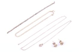 A vintage Italian '14K' filed-curb bracelet, two yellow metal necklaces and a pair of knot earrings.