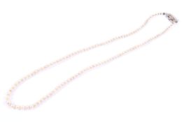 A cultured-pearl single row necklace on a diamond clasp. The cultured pearls graduated approx. 5.