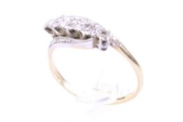 A mid-20th century gold and diamond five stone cross-over ring.