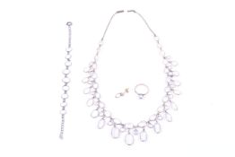 A small group of moonstone jewellery including a spectacle-set fringe necklace.