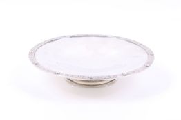 A silver tazza or cake stand on foot.