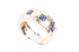 A vintage sapphire and diamond broad band ring.