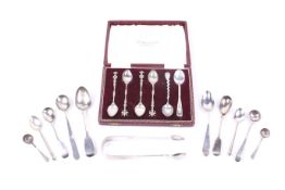 A Victorian Exeter fiddle pattern sugar tongs and various spoons.