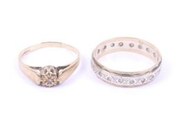 A 9ct gold and tiny diamond single stone ring and a paste eternity ring.