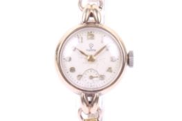 Tudor, a lady's 9ct gold cased round wrist watch on a rolled-gold bracelet.