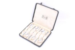 Liberty, a set of six silver and enamel coffee spoons.