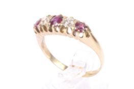 An early 20th century gold, ruby and diamond five stone ring.