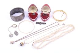 A collection of silver, white metal and costume jewellery including a broad-bangle.
