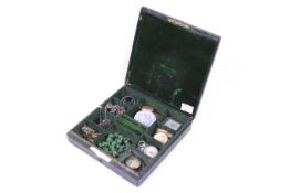 A collection of Victorian and later jewellery in a green velvet lined box.