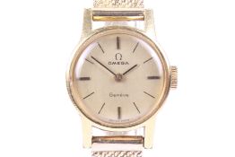 Omega, a lady's gold-plated and stainless steel round wrist watch circa 1969,