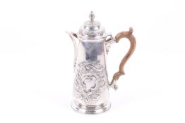 A silver straight sided coffee pot.