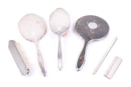 A silver mounted composite six piece dressing table set.