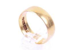 A late Victorian 22ct gold broad wedding band. Hallmarks for Birmingham 1900, 6.