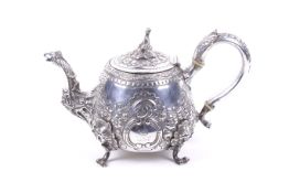 A late George III silver teapot.