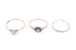 Three 9ct gold and diamond set rings.
