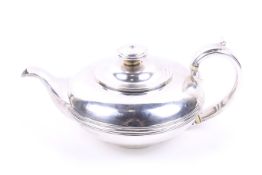 A George IV silver compressed round tea pot.