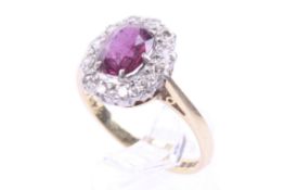 A vintage 18ct gold, ruby and diamond oval cluster ring.
