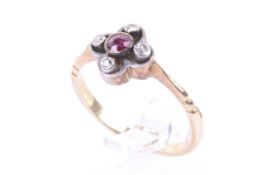 A mid-20th century gold, ruby and diamond open quatrefoil ring.