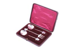 Daniel George Collins, two Art Nouveau silver and enamel spoons and a barbed fork.