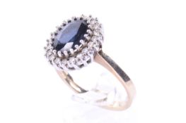 A vintage 9ct gold, sapphire and diamond oval cluster ring.