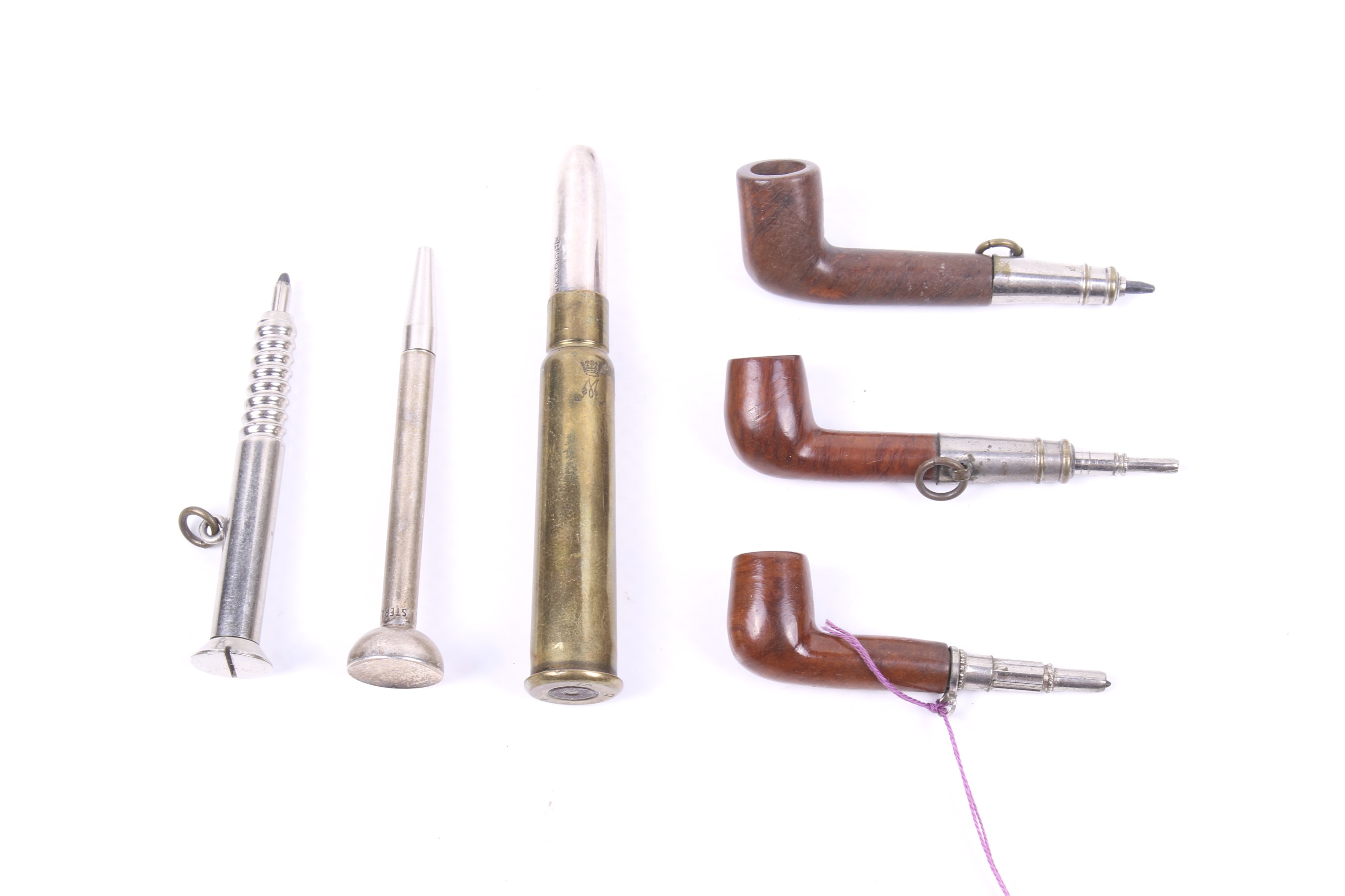 A group of five propelling pencils including three in the form of a pipe.