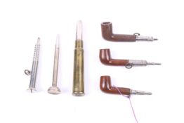 A group of five propelling pencils including three in the form of a pipe.