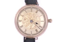 An early 20th century Swiss gold open face fob watch later adapted as a wrist watch.